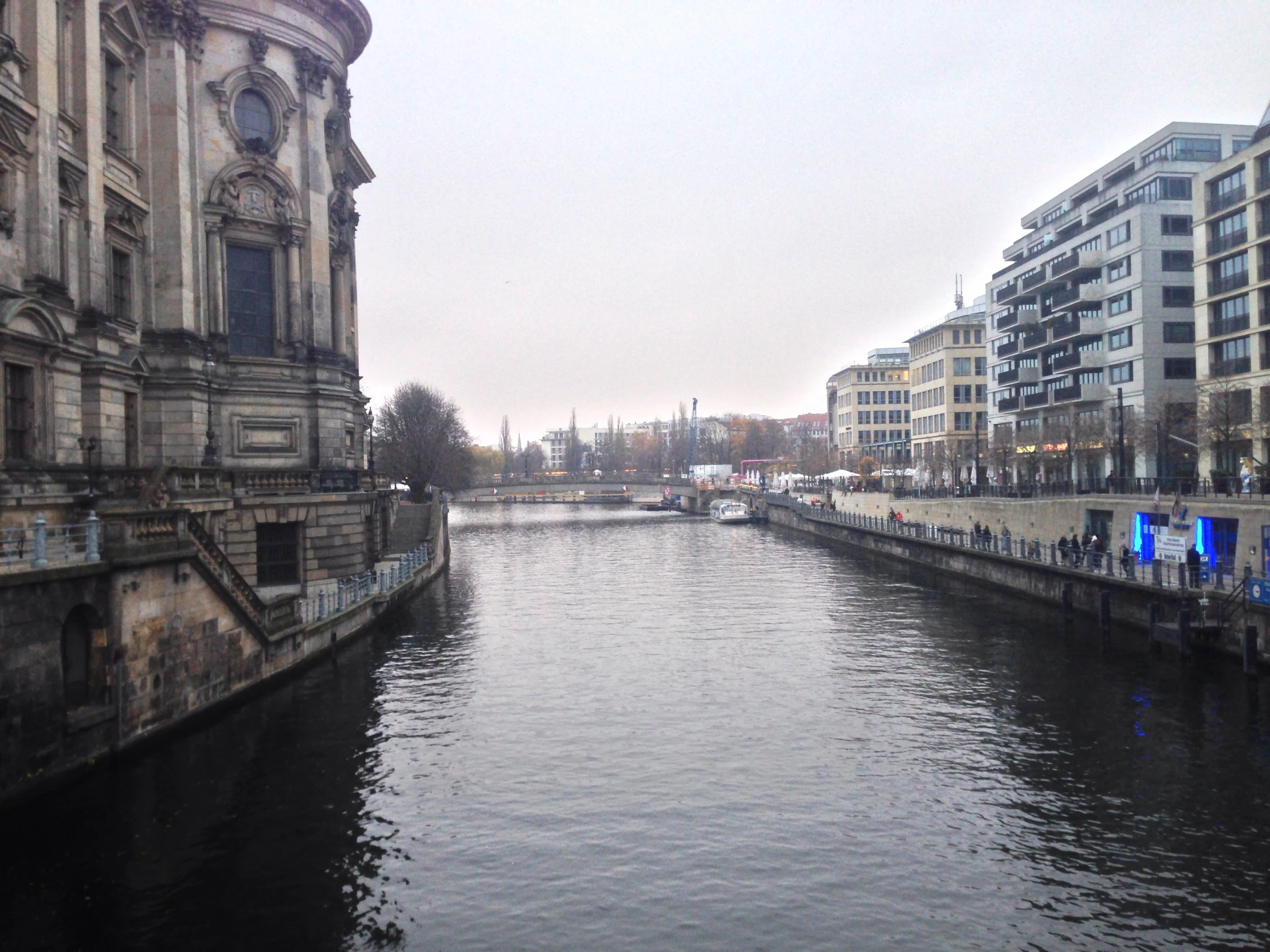 this is a body of water with buildings and street lights