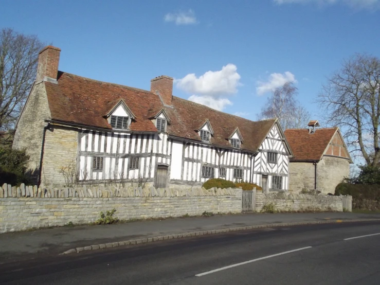 a row of houses with brick walls in the background