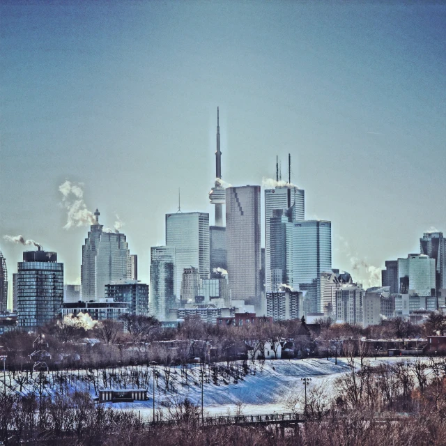 this is a po of a skyline of tall buildings in the winter