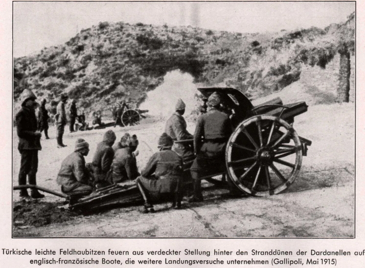 a black and white po of men standing around a cannon