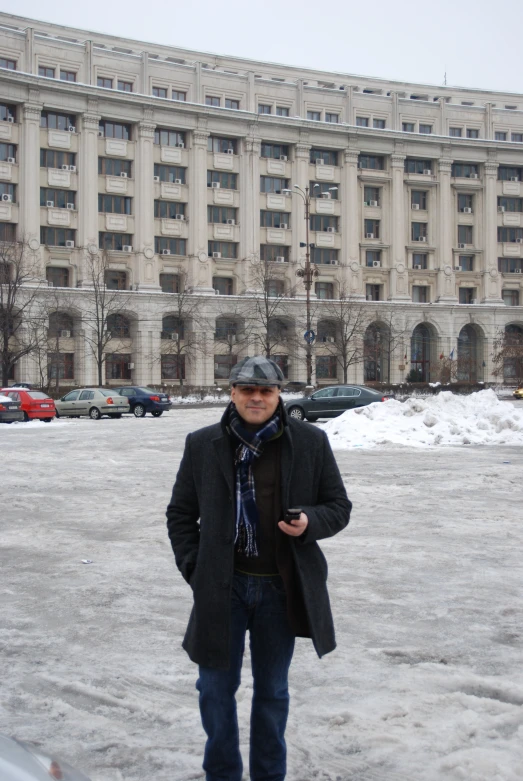 an older man standing in front of a el