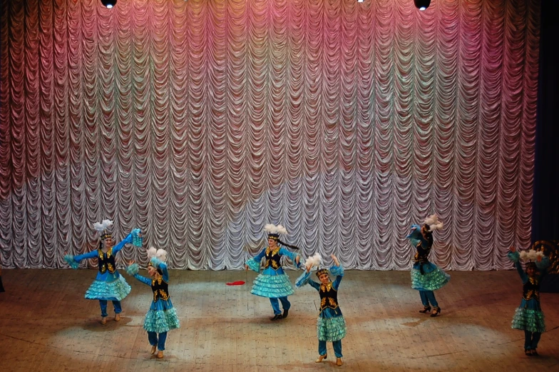 an elaborately decorated dance scene from a musical school