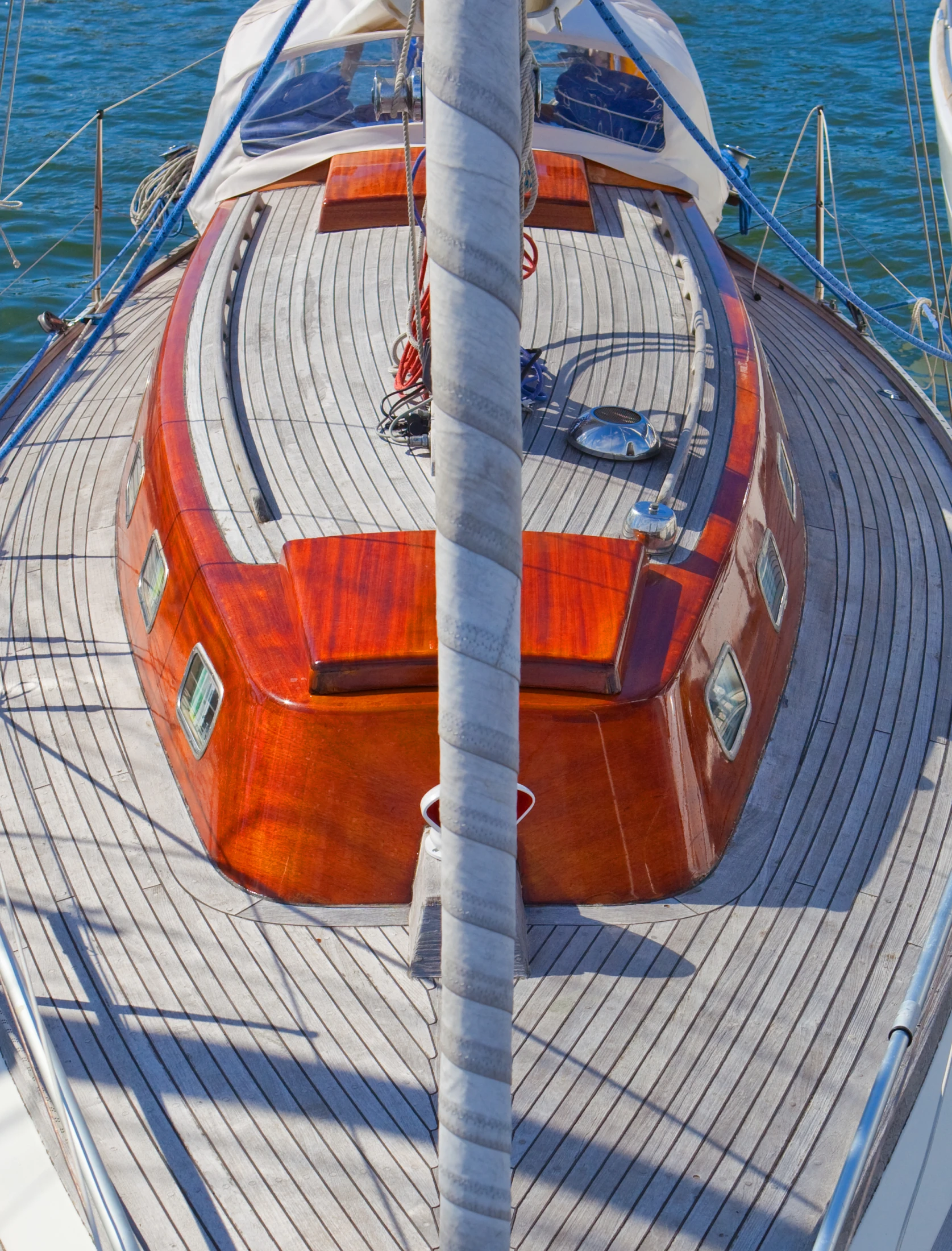 a large brown wooden boat floating on top of water