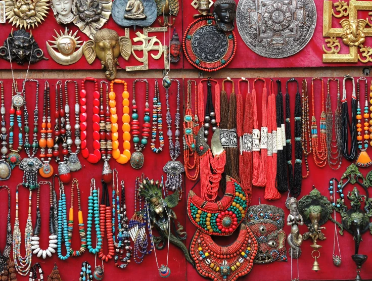 a jewelry rack is full of many necklaces and jewelry
