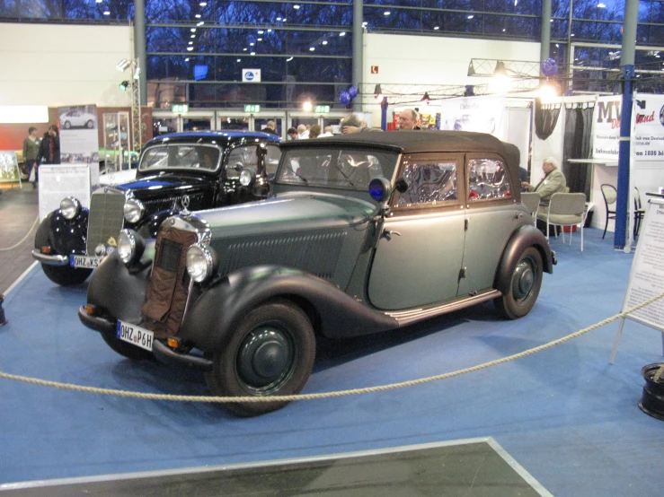 a vintage car on display at an auto show