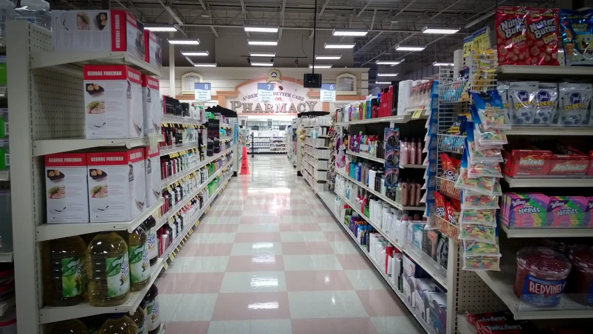 a grocery aisle with an aisle lined with products