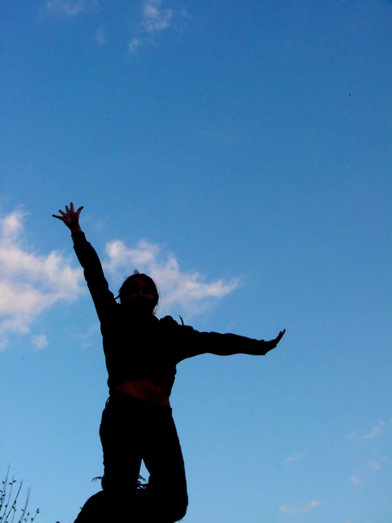 person on skate board jumping high in the air