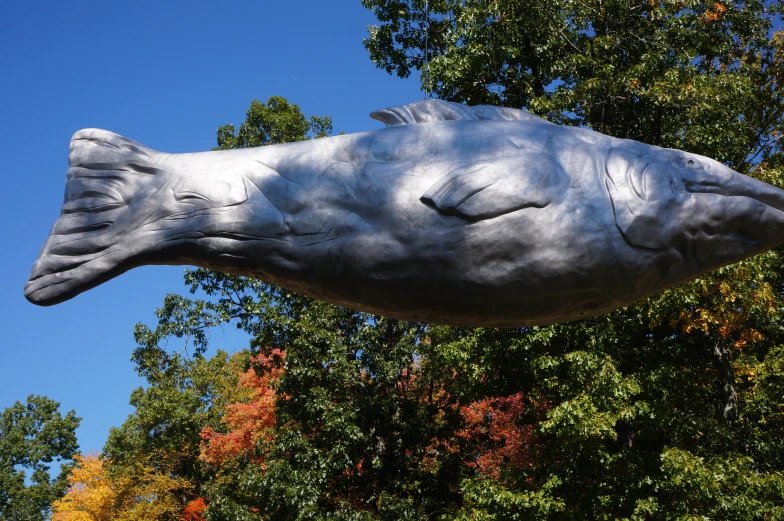 a sculpture of a fish on a pole