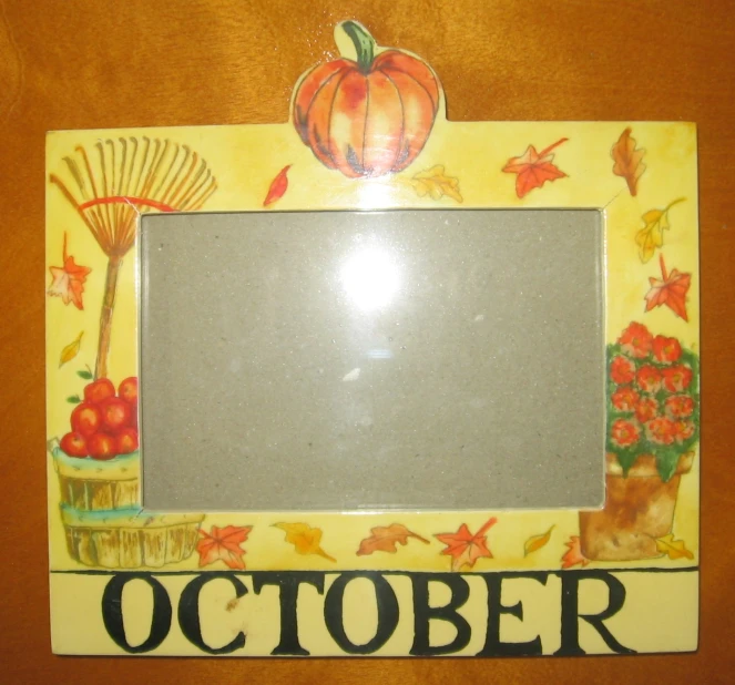 an orange and yellow fall themed frame with a pumpkin