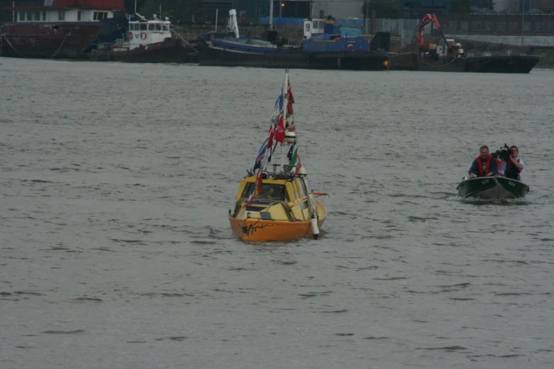 two boats are moving through the water near boats