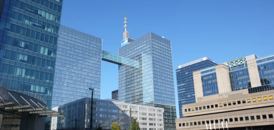 modern glass and steel buildings in the middle of a city