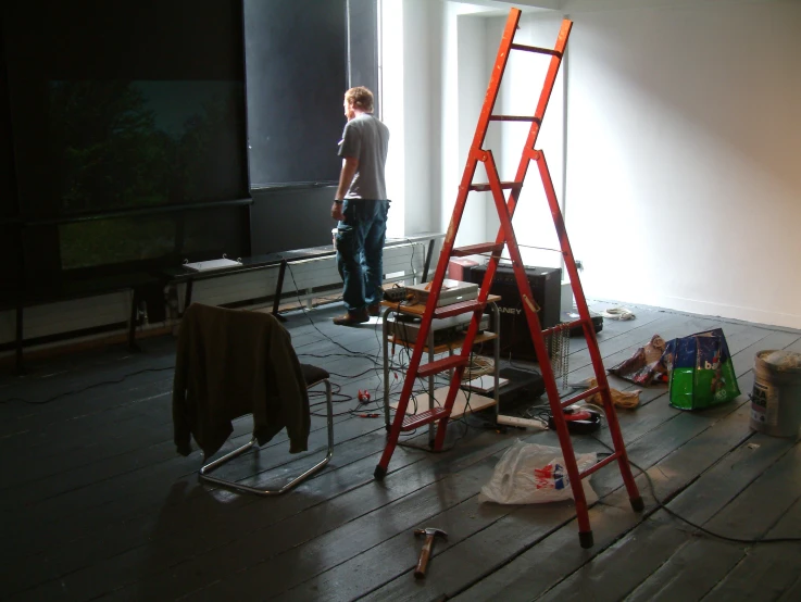 a ladder is leaning against a wall