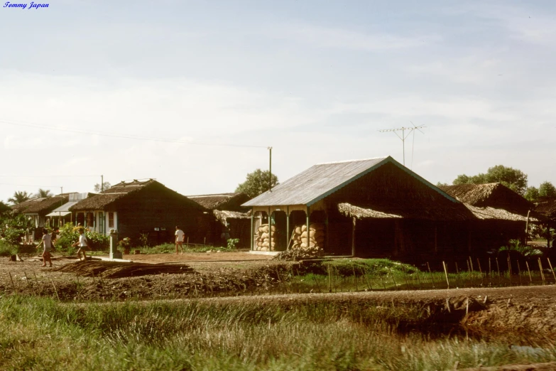 a bunch of buildings that are next to a stream