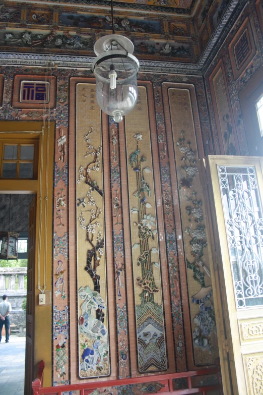 an elaborate mural on the wall of a house