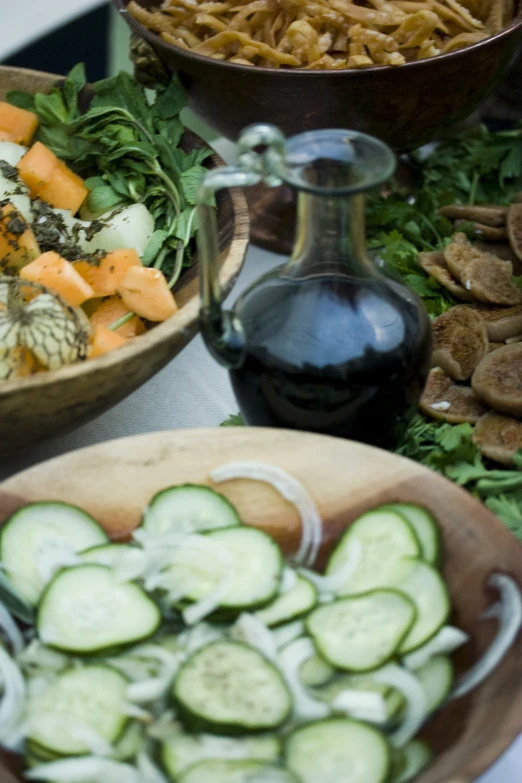 some dishes with various foods that are on a table