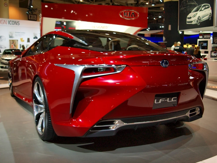 a very modern looking red toyota car on display