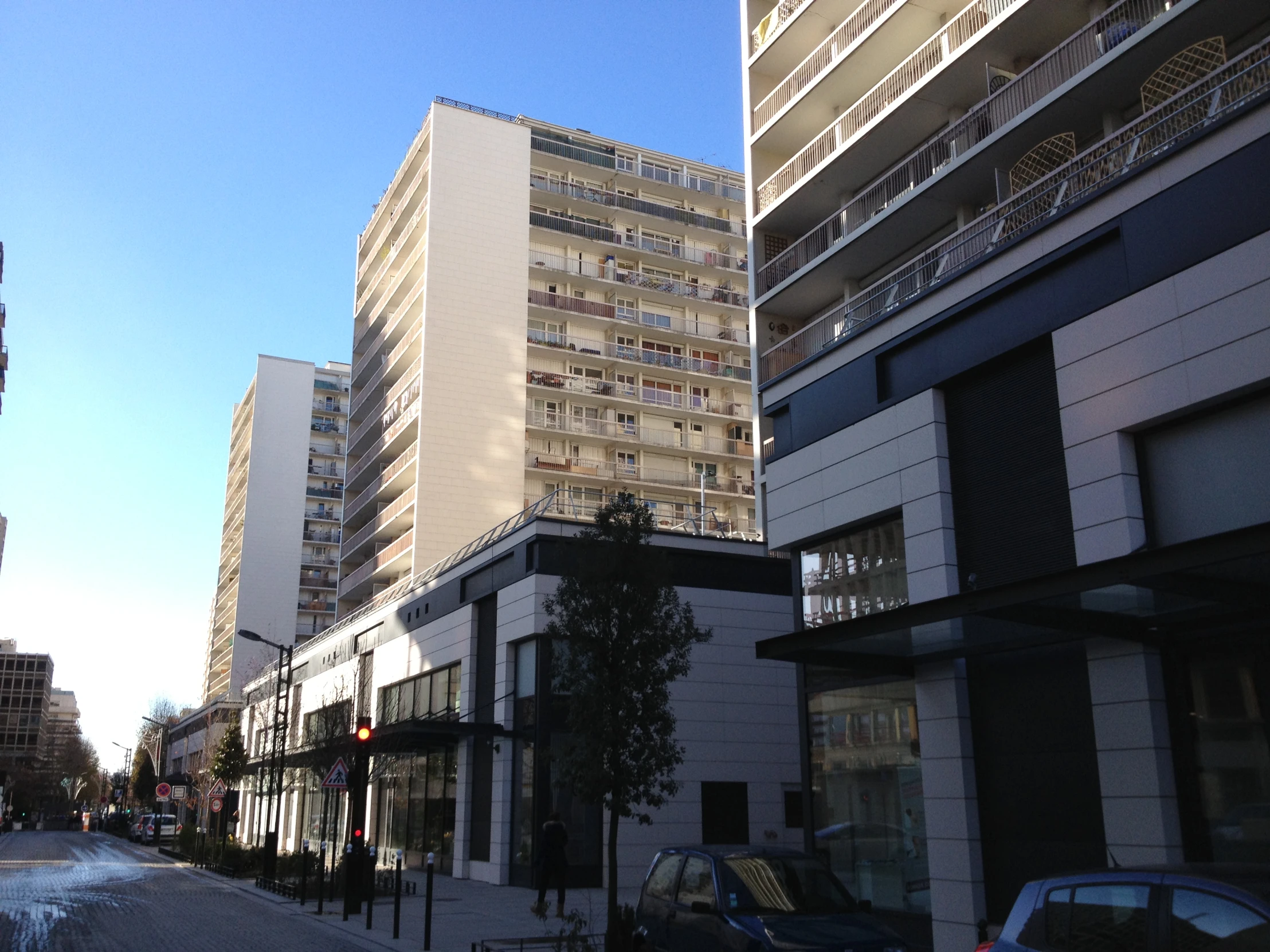 the view from a street on many buildings and cars