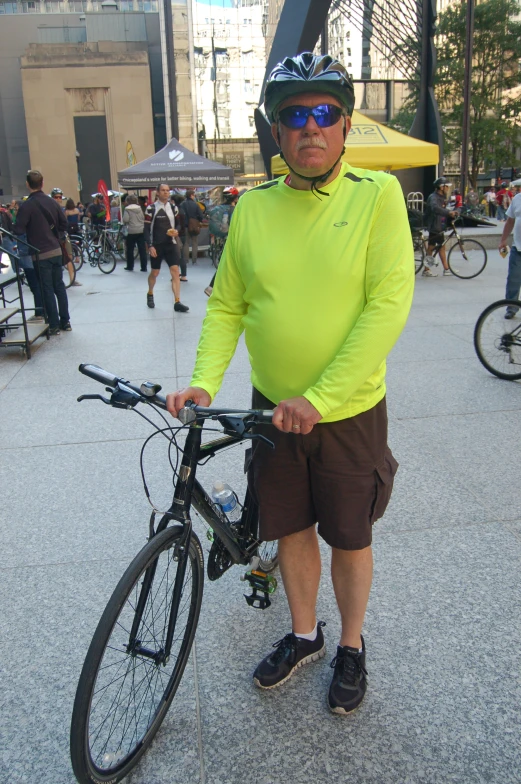 a person is holding a bike by the wheel