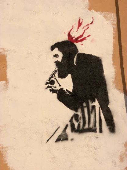 a spray painted picture of a man holding a weapon