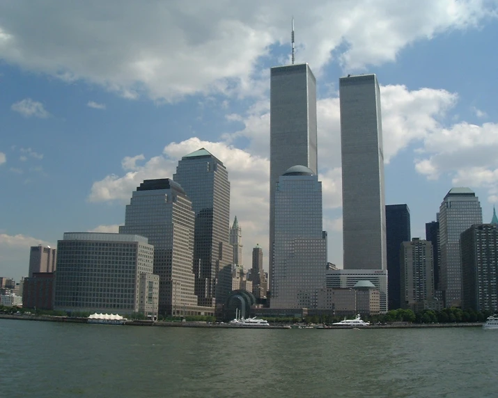 two towers sticking out of the side of a city