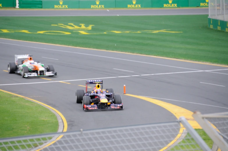 two racing cars driving on a track