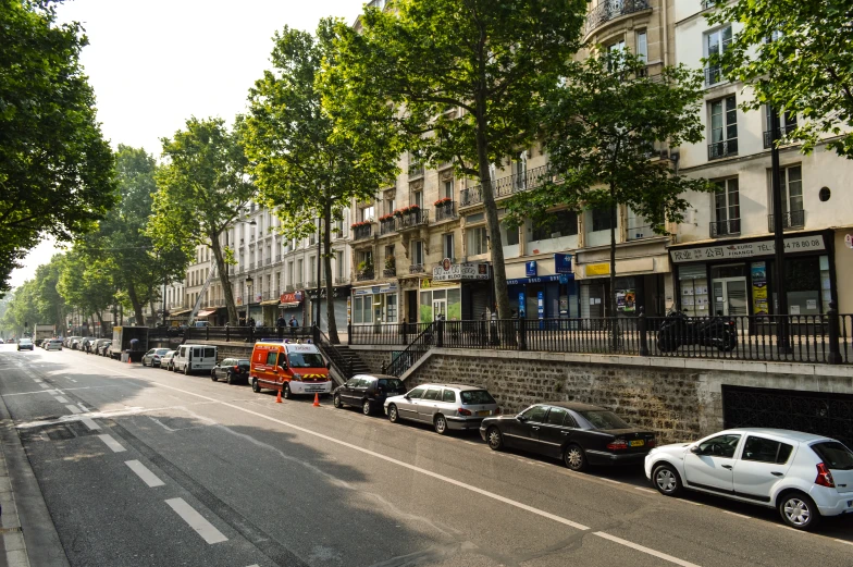 the cars are lined up on the side of the road