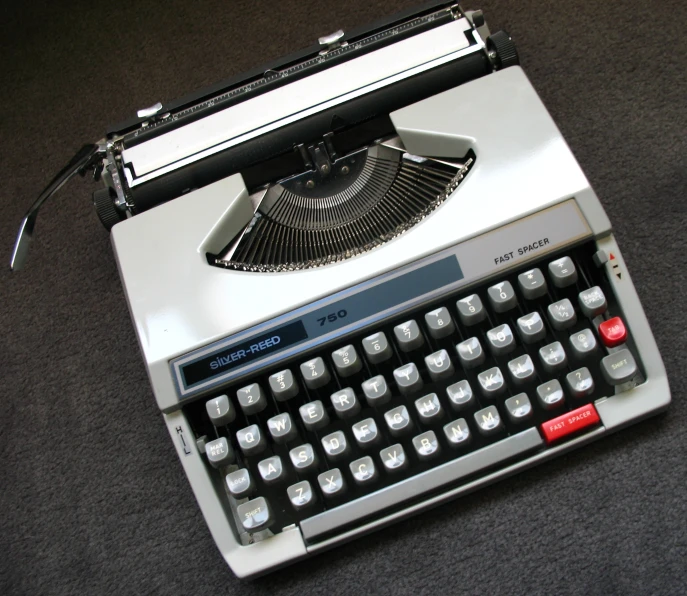 a typewriter with it's manual on