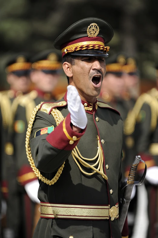 a person in uniform making a face and pointing at soing