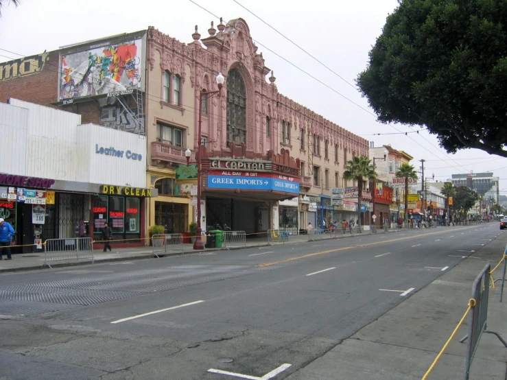 an empty street is full of shops along with people