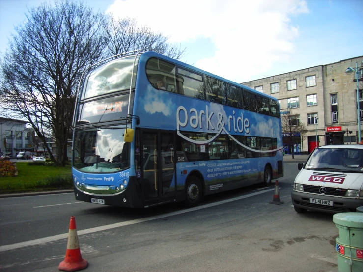 a double decker bus is driving down the street