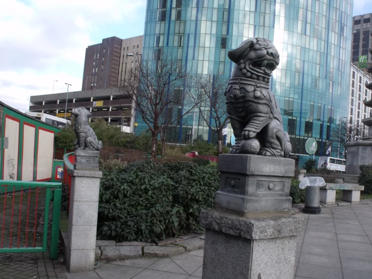 a large stone statue with a dog on it