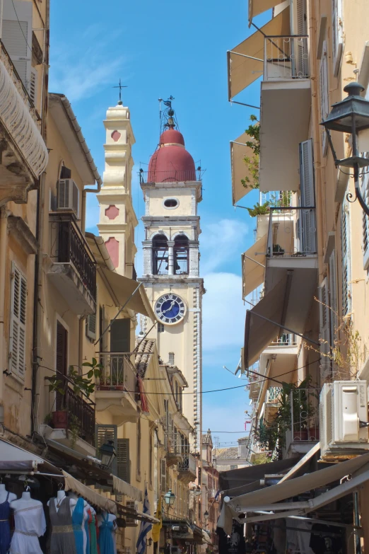 there are some tall buildings with a red and white clock