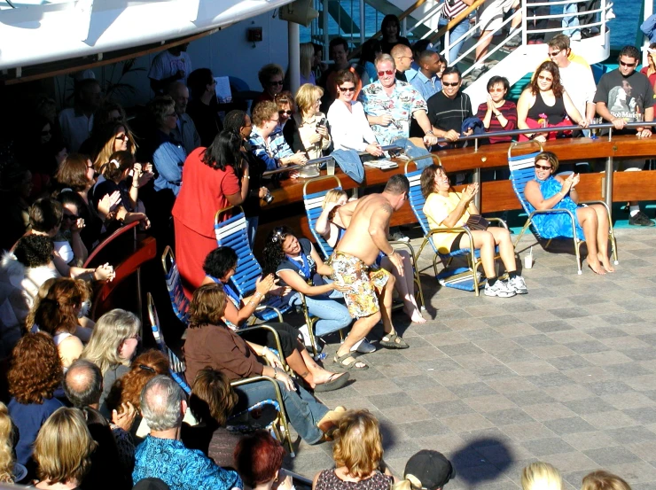 a crowd of people on a large boat