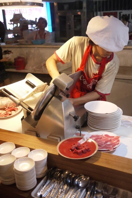 a chef preparing food in a large commercial kitchen