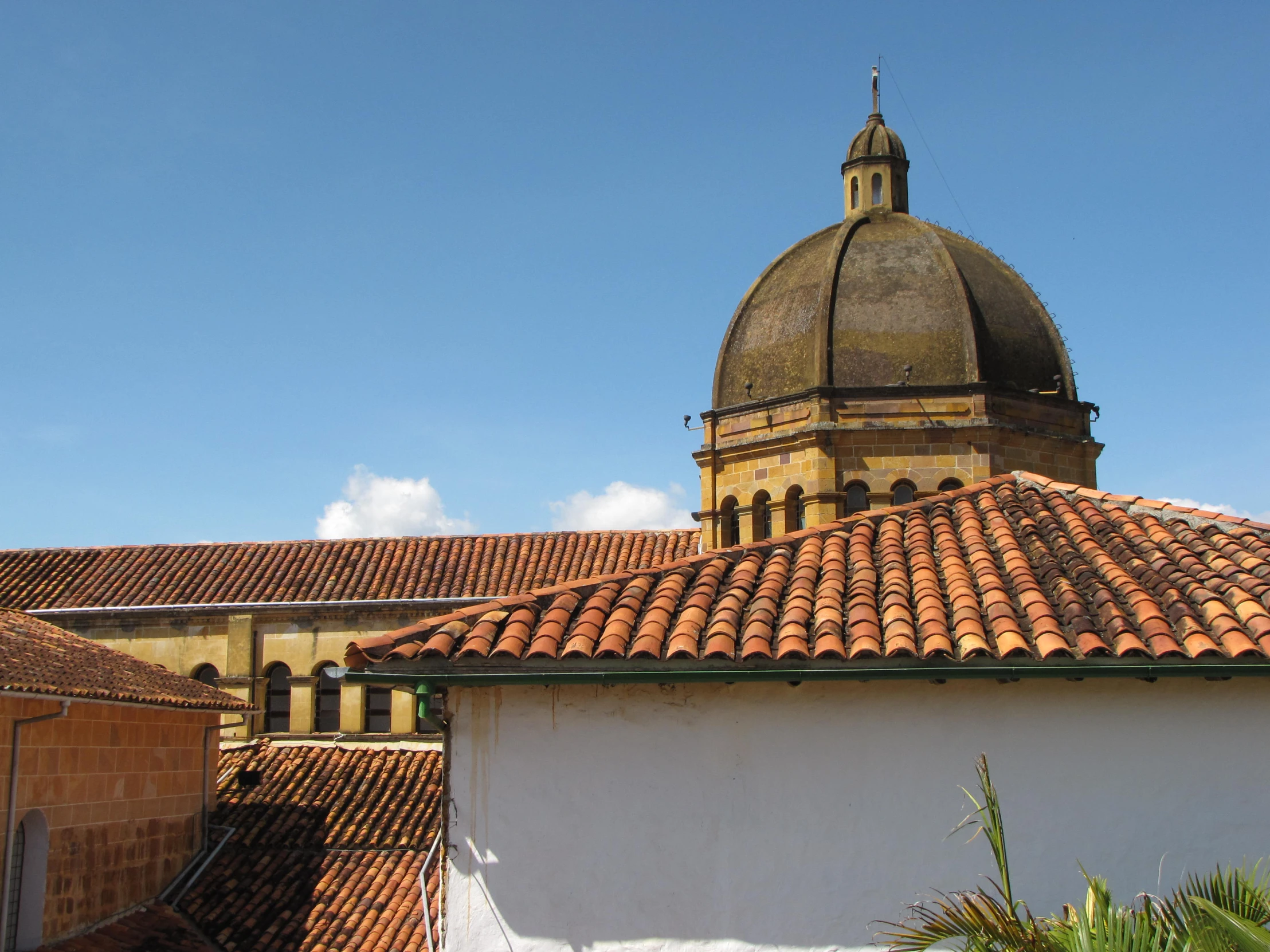 some people standing around a building with a dome