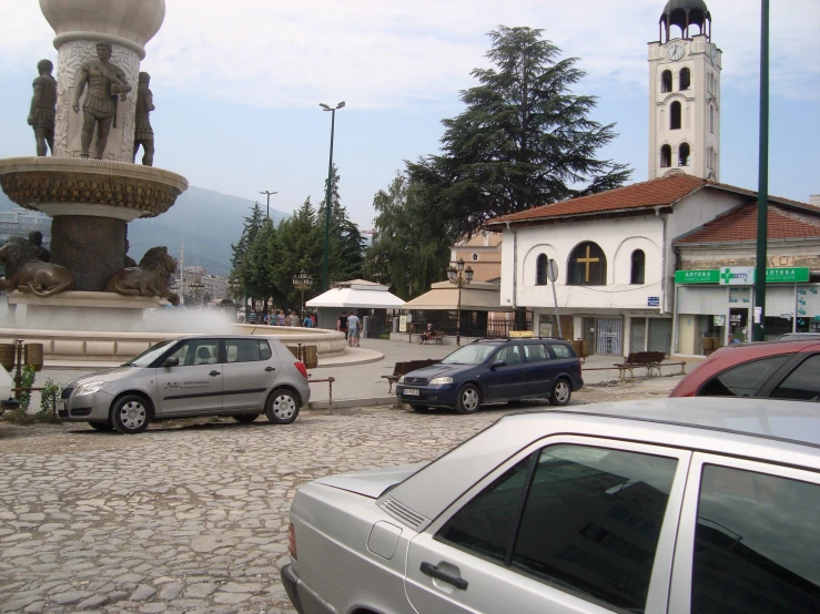 a small fountain in a small town square