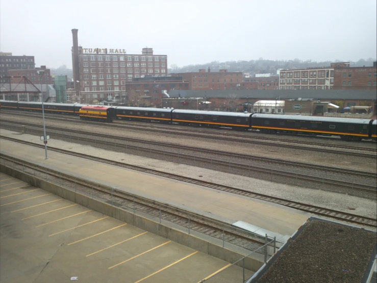 two train tracks sitting side by side in the fog