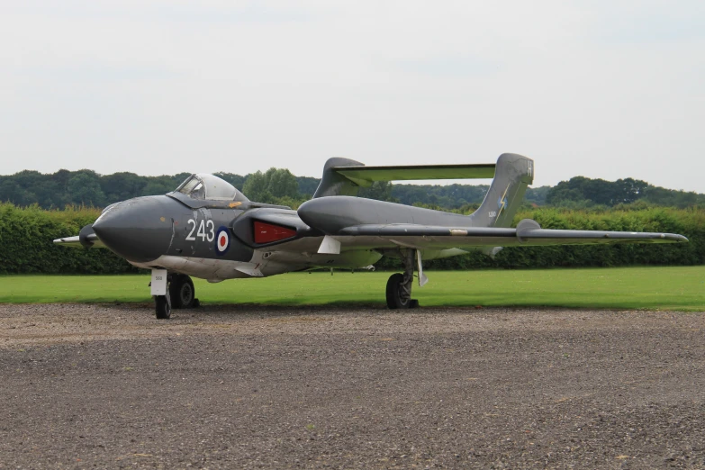 the propeller plane has landed on a grass field