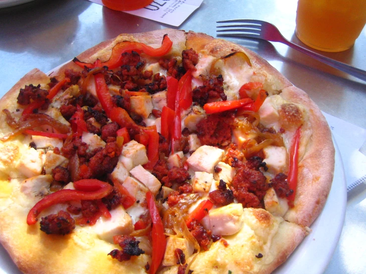 a very large pizza sitting on top of a table