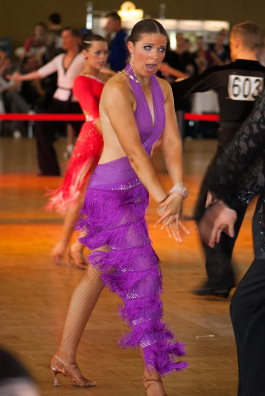 woman in purple dress at a dancing competition