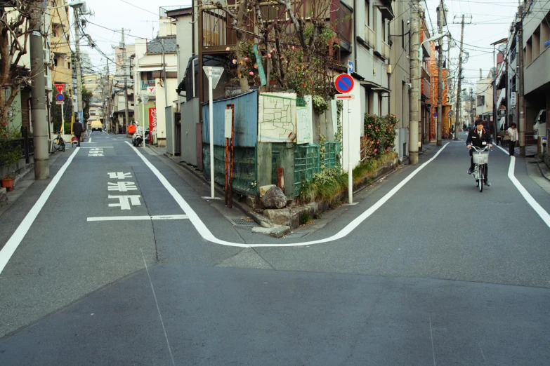 an empty street with lots of buildings on both sides