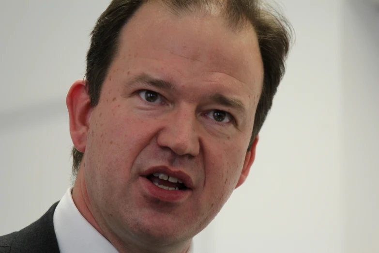 man in suit with an intense look on his face