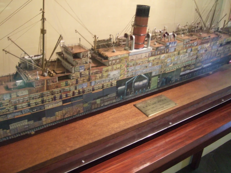 a toy model of a ship with wooden parts