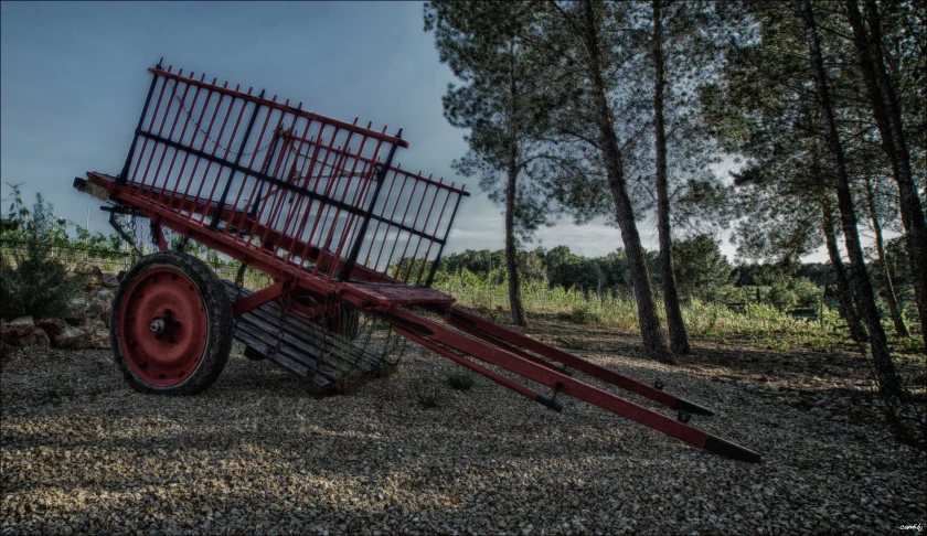 red wagon leaning over to pull two bars