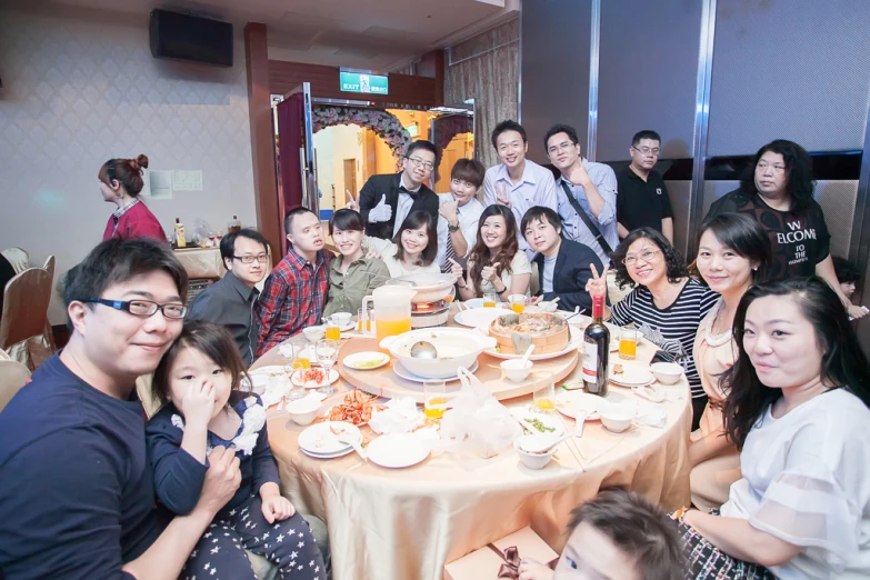 a group of people gathered around a round table