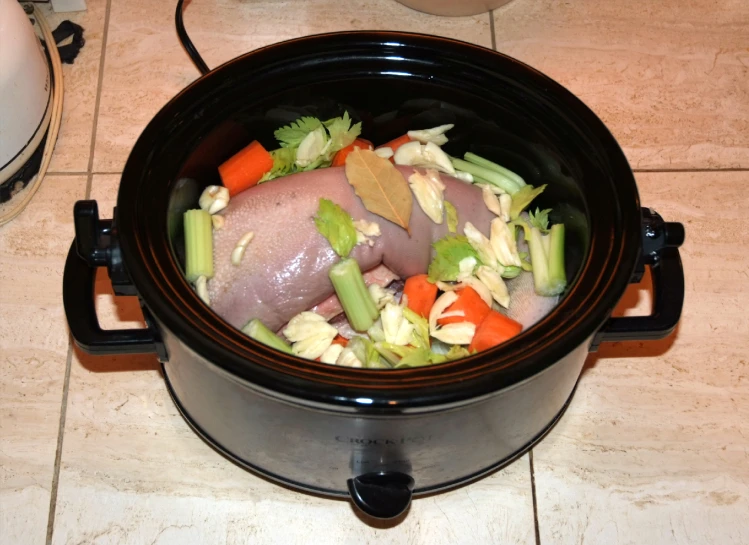 the bowl is full of steamed vegetables and meat
