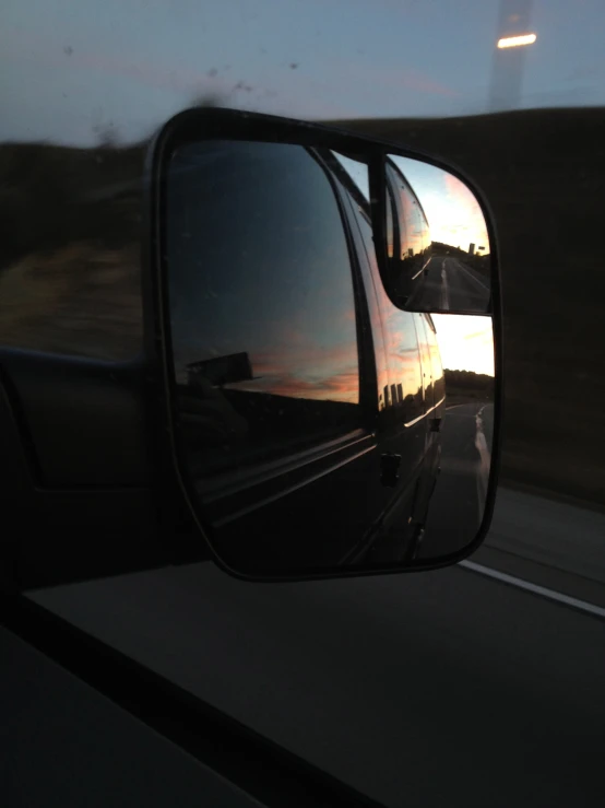 a rear view mirror on a vehicle's side