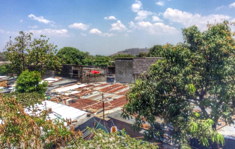 the roof of a building is being constructed with wood and concrete