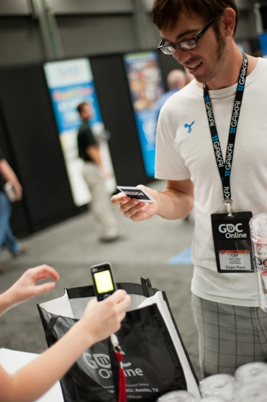 a person at an event is showing a phone