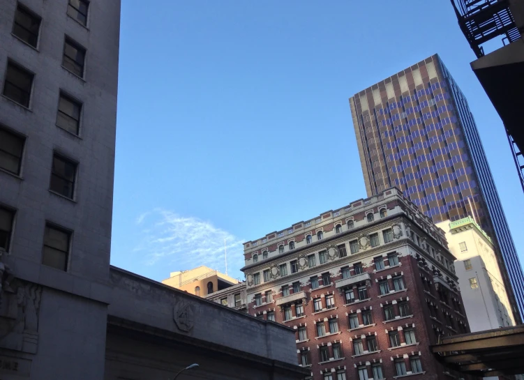 a building is shown in the distance against a blue sky